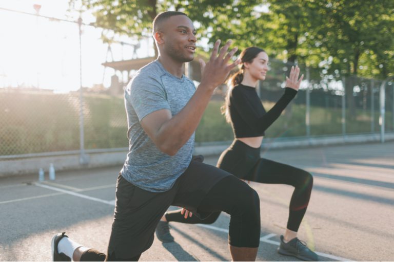A man and a woman exercise outdoors. This type of behavioural prevention leads to a healthy life. 