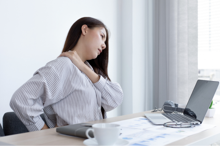 Employee with back and neck pain working from home